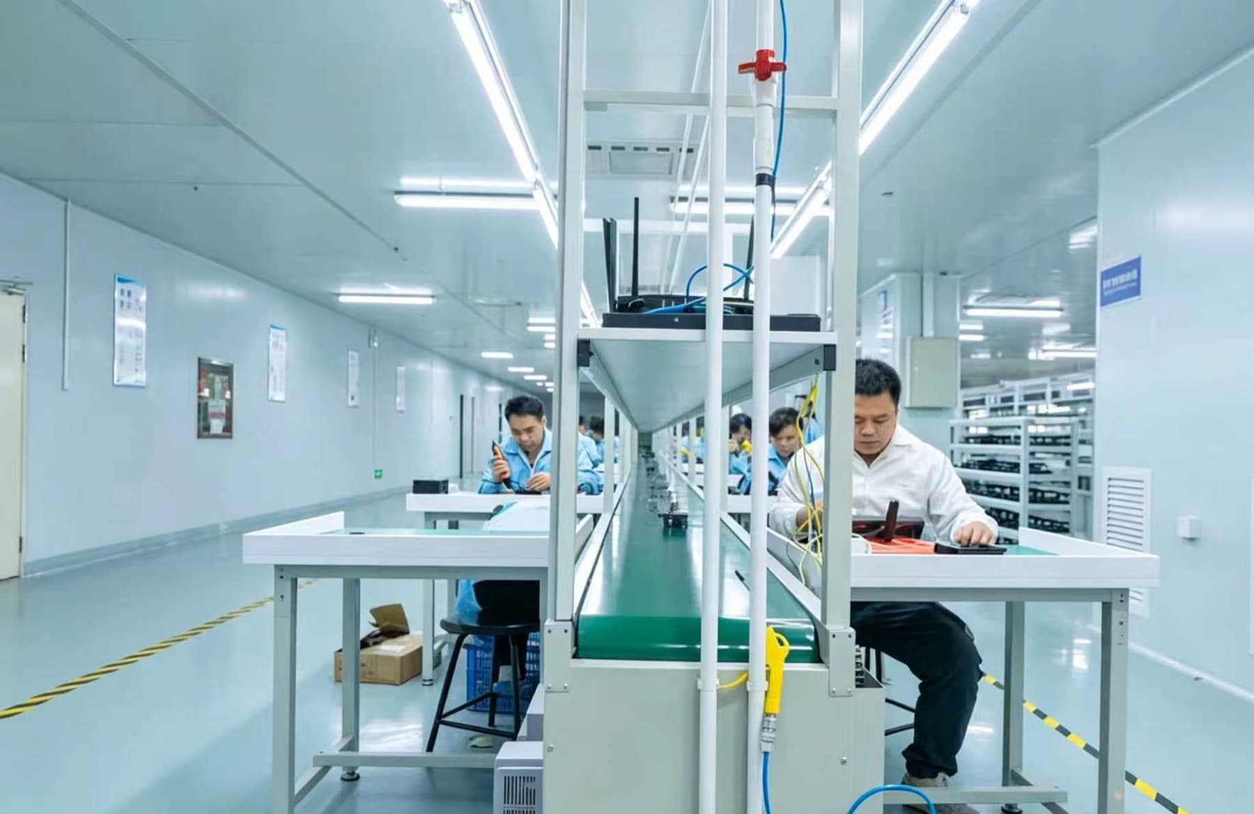 YOUNUO IET technicians working on a smart lock assembly and final inspection line in Shenzhen