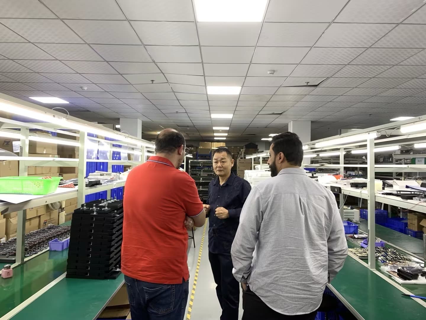 International buyers reviewing the YOUNUO IET smart lock production line with the company team