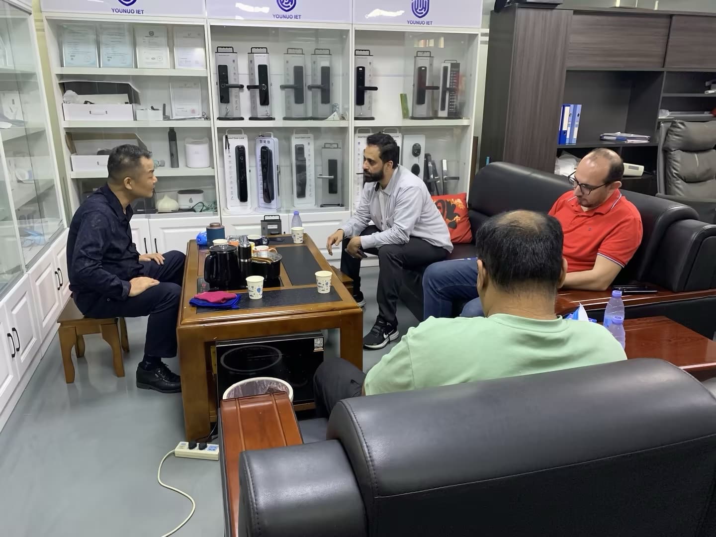YOUNUO IET team reviewing smart lock OEM and ODM project requirements with international buyers